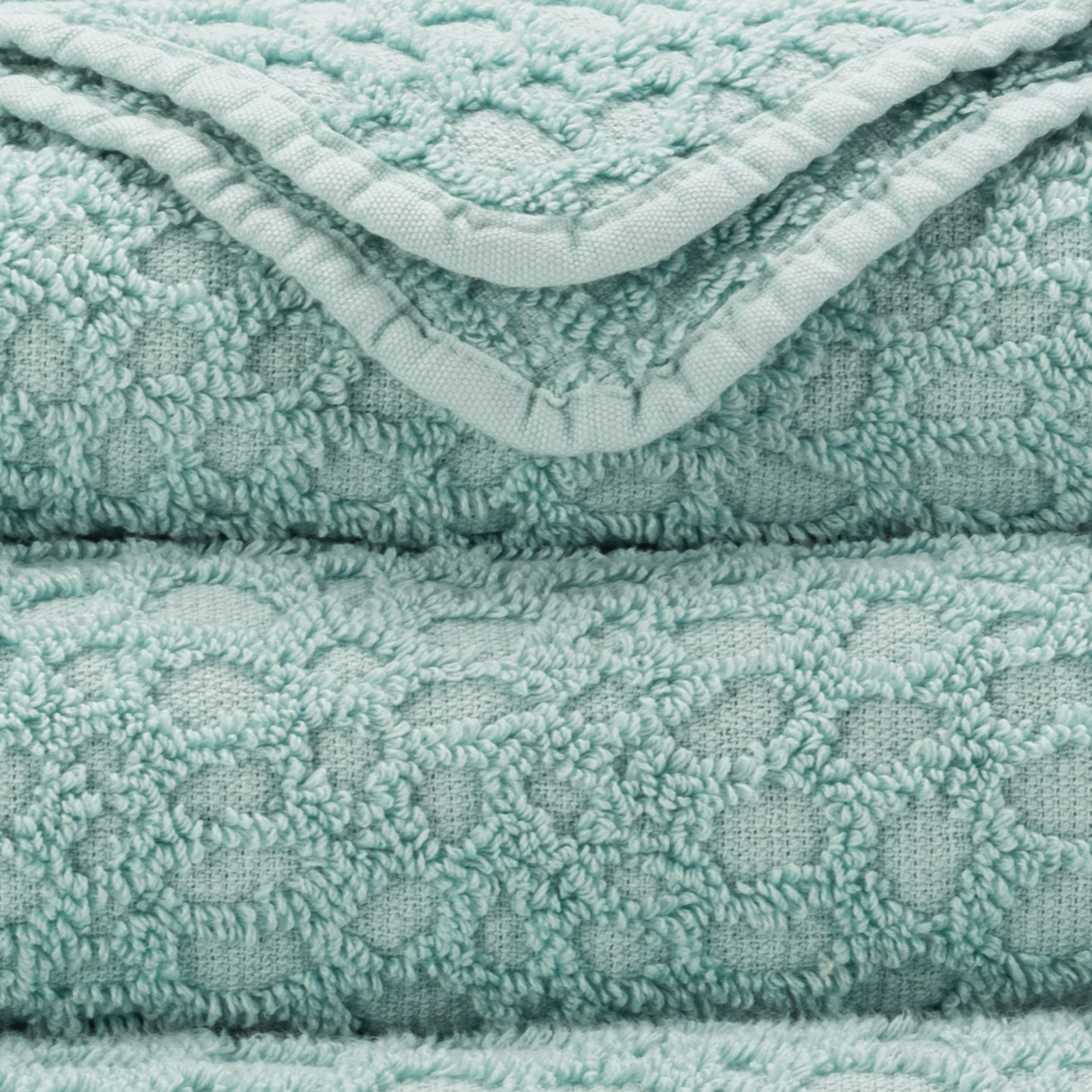 Corner View of Abyss Lodge Bath Towels in Ice Color