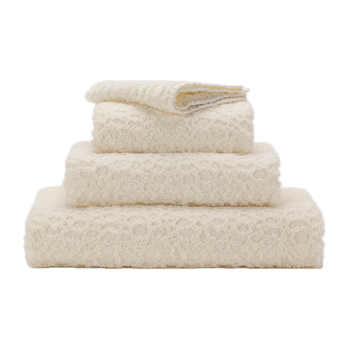 Stack of Abyss Lodge Bath Towels in Ivory Color