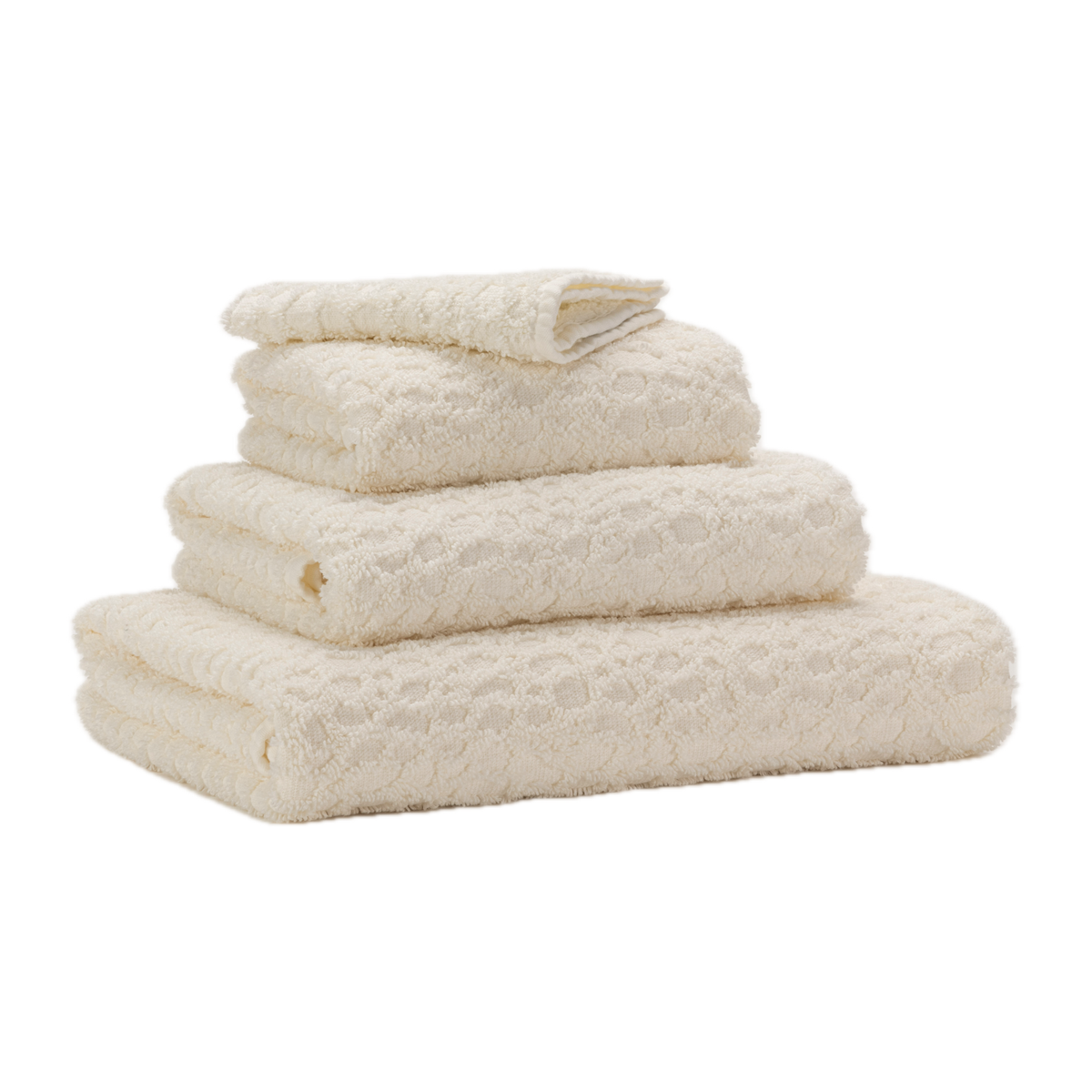 Corner View of Abyss Lodge Bath Towels in Ivory Color