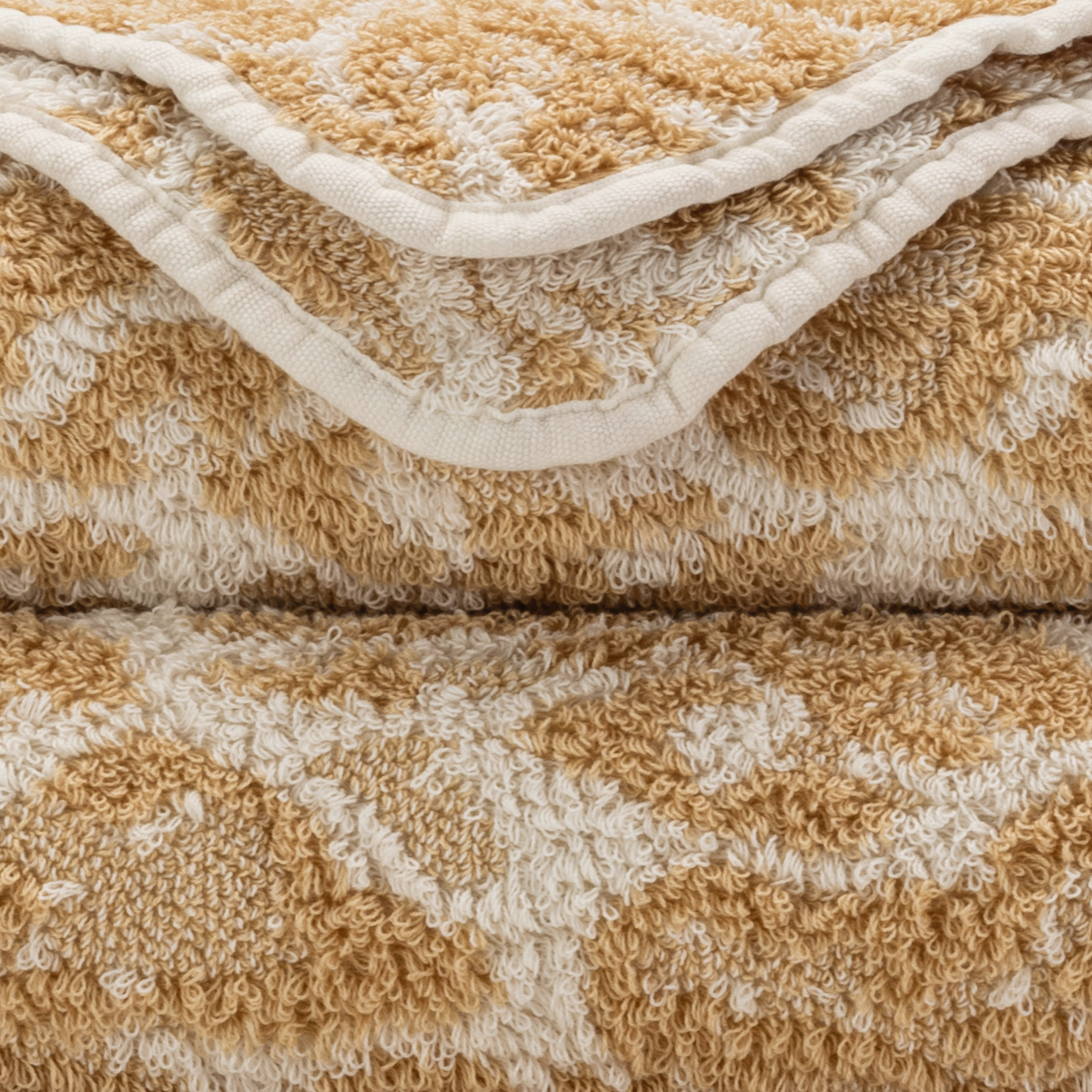 Closeup of Abyss Sauvage Bath Towels in Sand Color