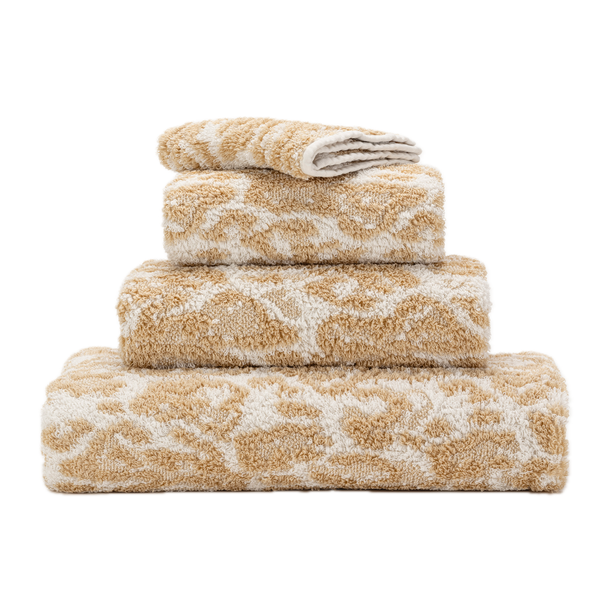 Stack of Abyss Sauvage Bath Towels in Sand Color