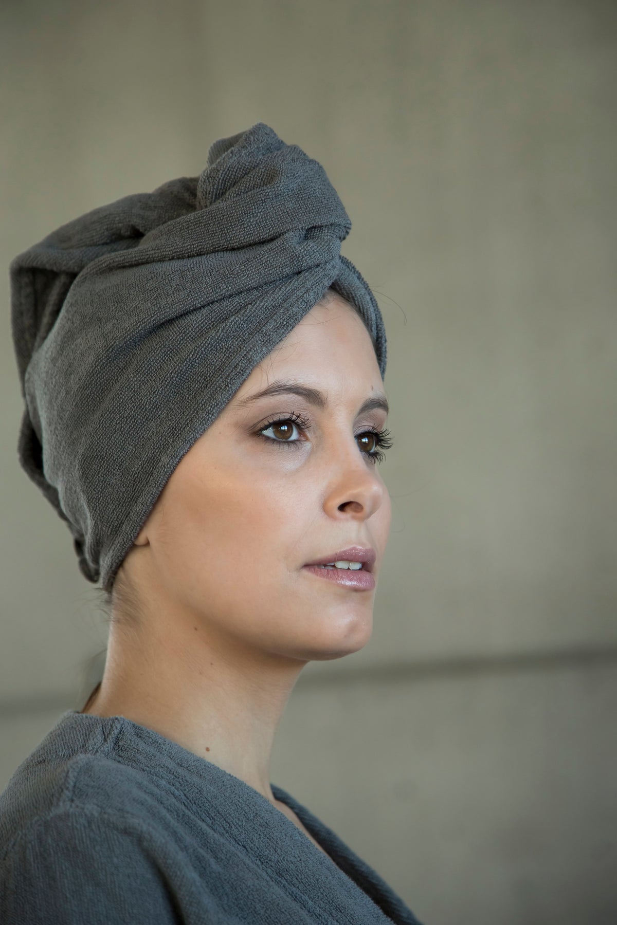 Model Wearing Abyss Spa Hair Towel in Color Atmosphere (940)