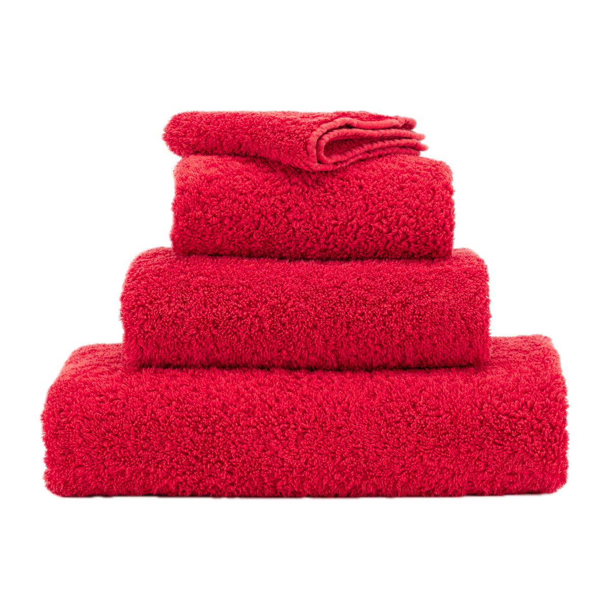 Stack of Abyss Super Pile Bath Towels in Carmin Color