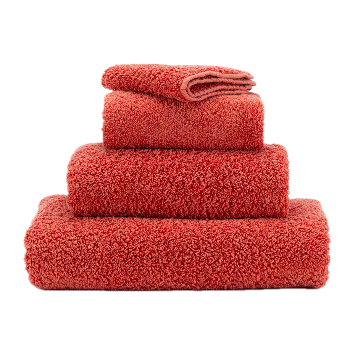 Stack of Abyss Super Pile Bath Towels in Chili Color