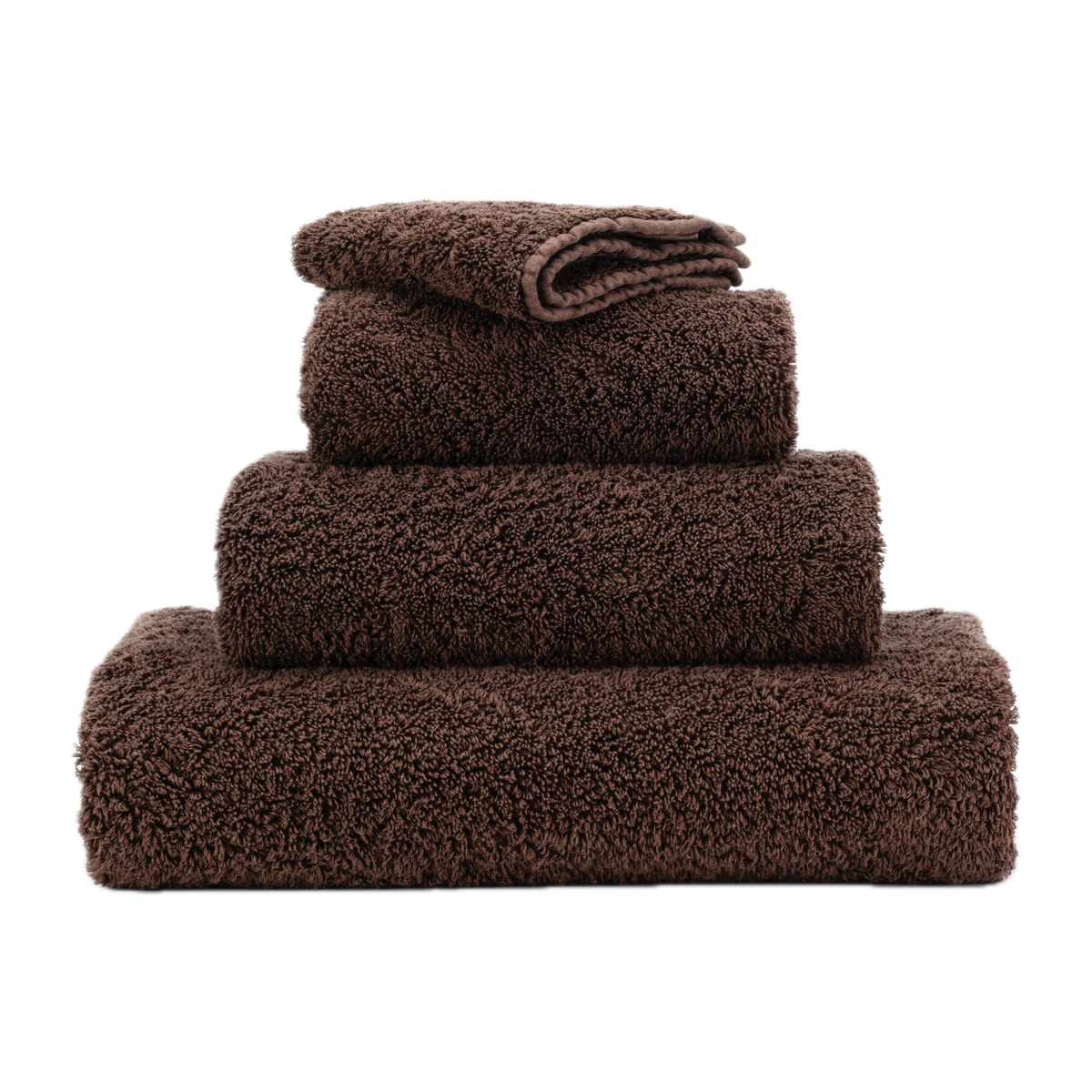 Stack of Abyss Super Pile Bath Towels in Mustang Color