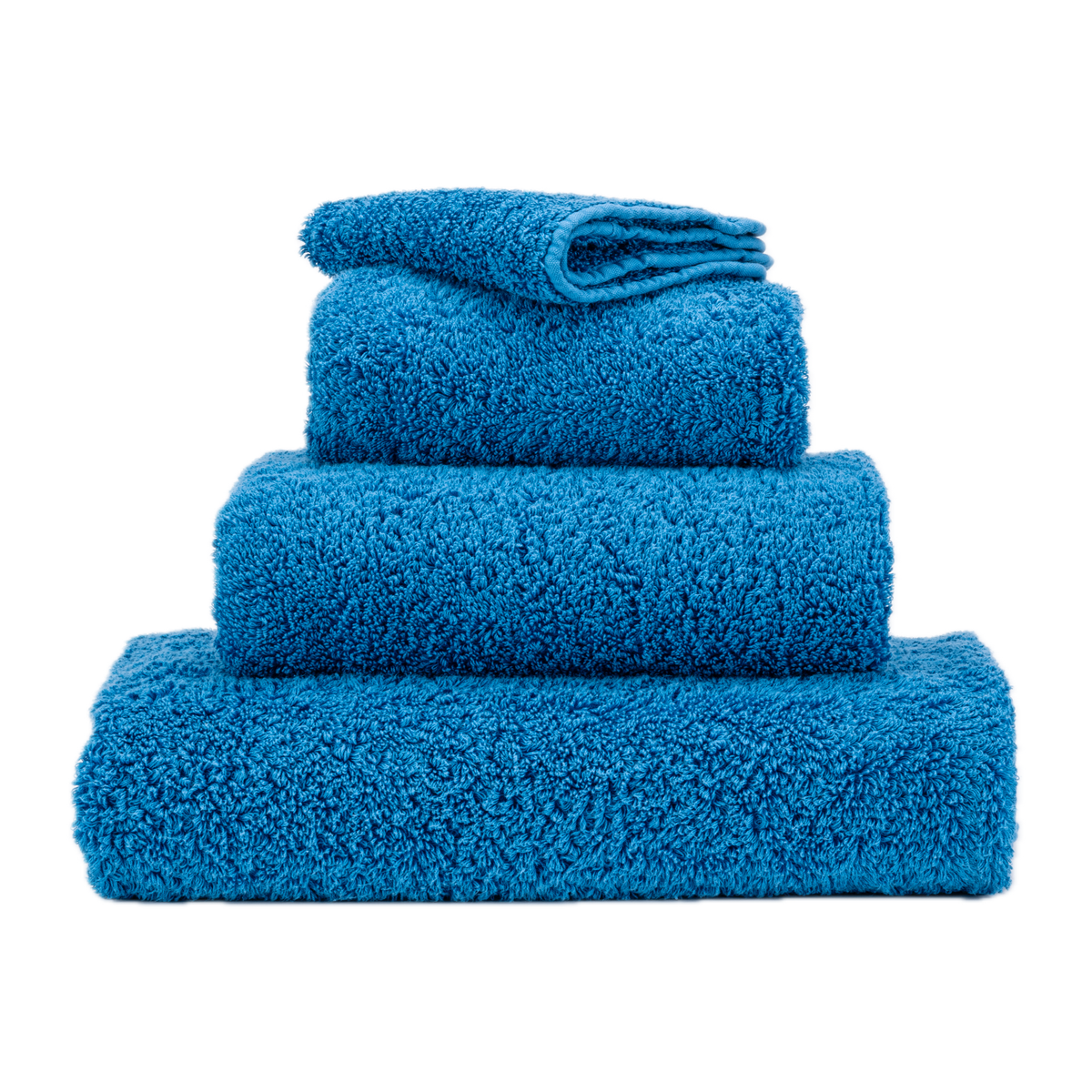 Stack of Abyss Super Pile Bath Towels in Ocean Color