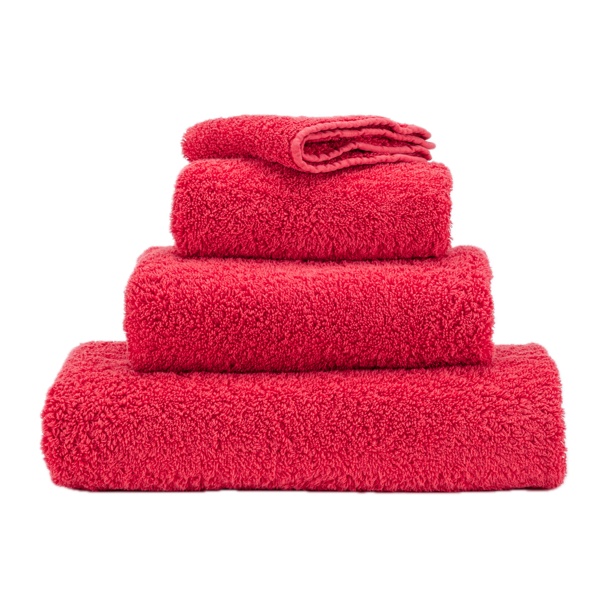 Stack of Abyss Super Pile Bath Towels in Viva Magenta Color