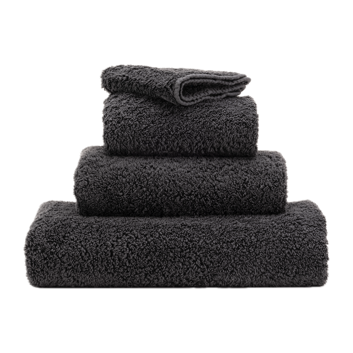 Stack of Abyss Super Pile Bath Towels in Volcan Color