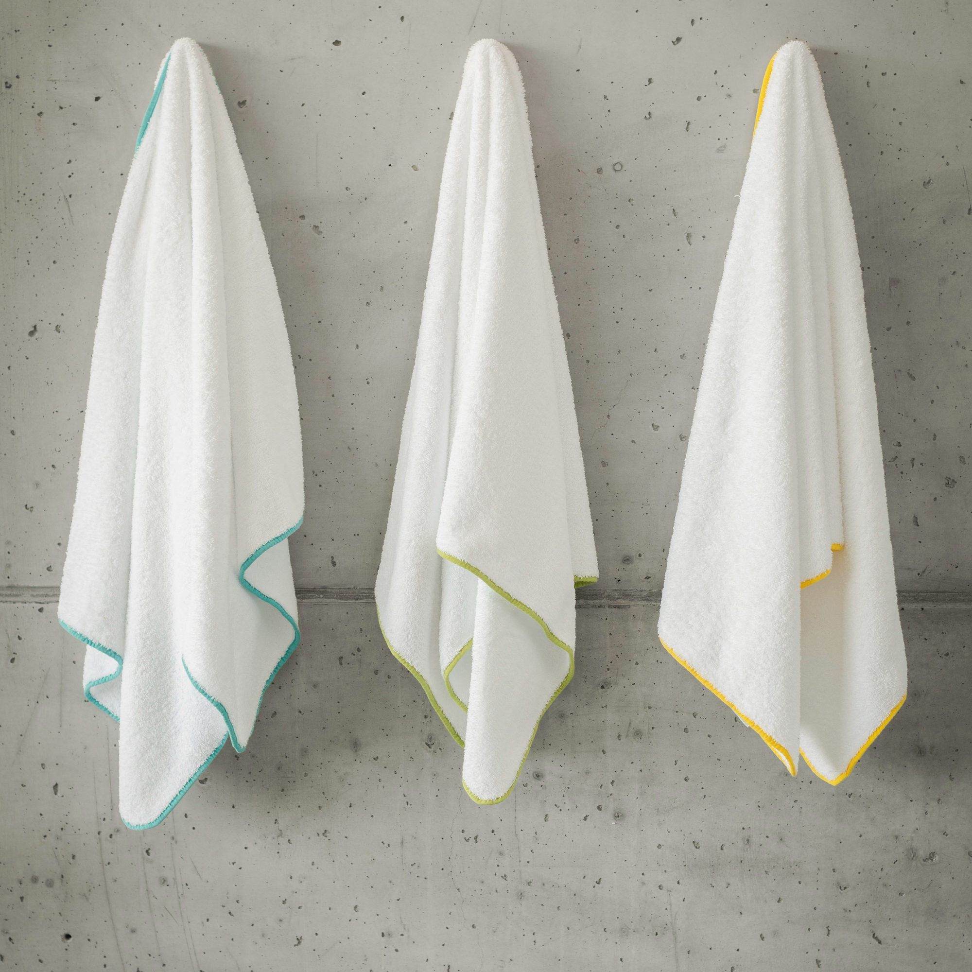 Hanging All Colors of Abyss Surf Bath Towels