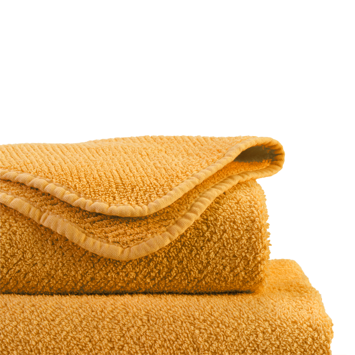 Folded Abyss Twill Bath Towels in Curcuma Color