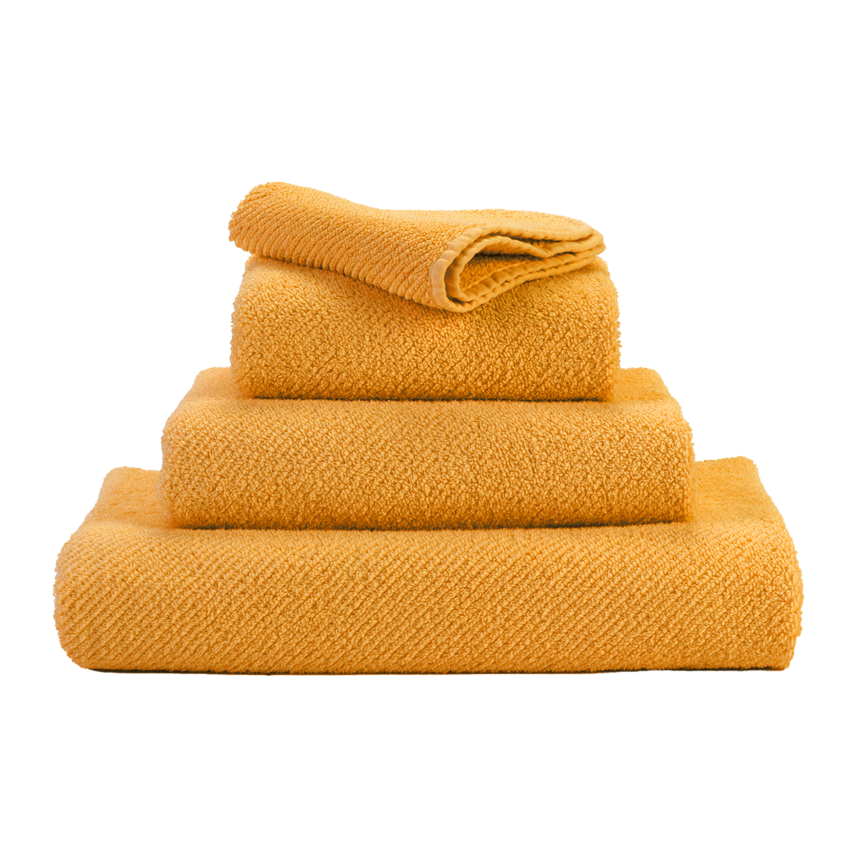 Stack of Abyss Twill Bath Towels in Curcuma Color