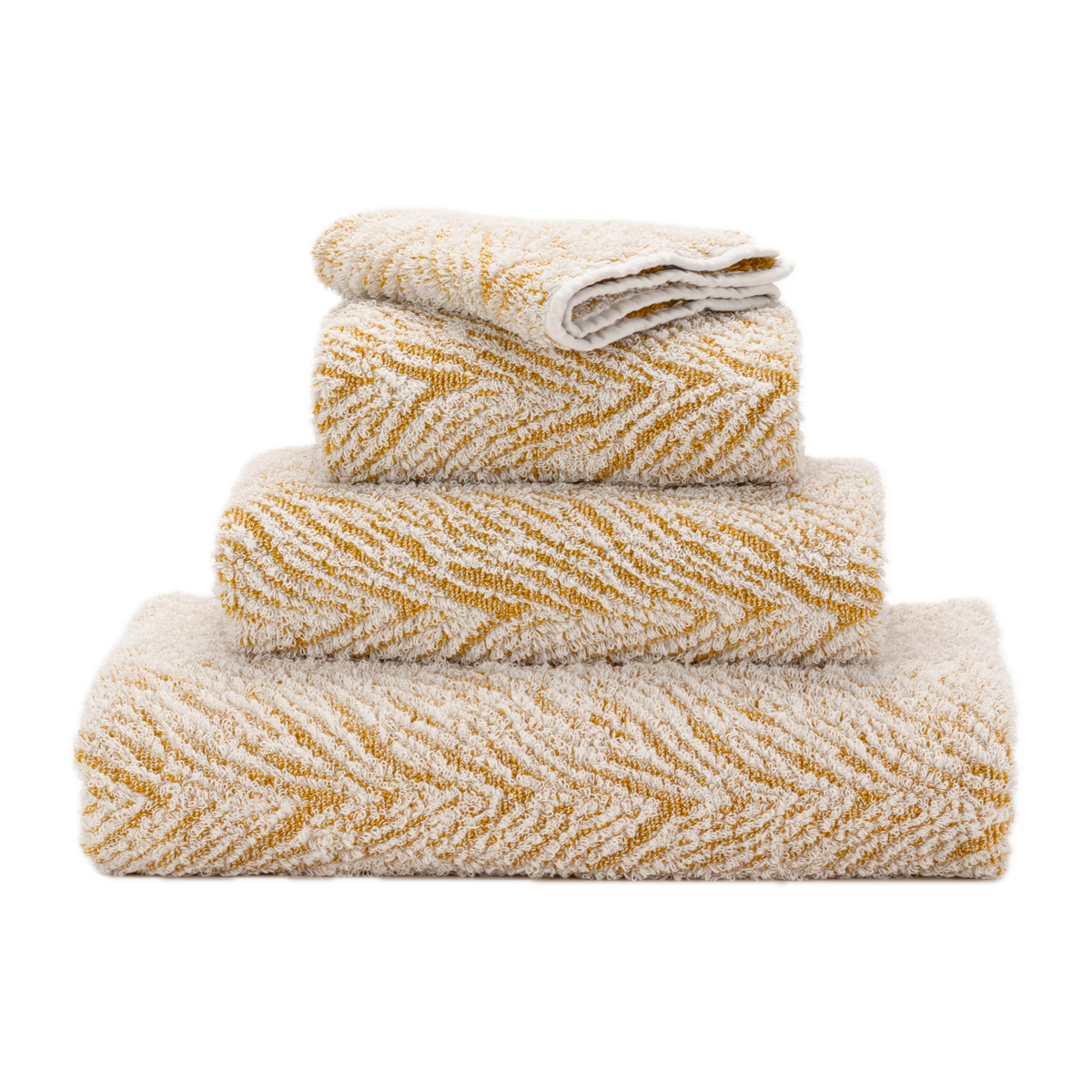 Stack of Abyss Vasco Bath Towels in Gold Color