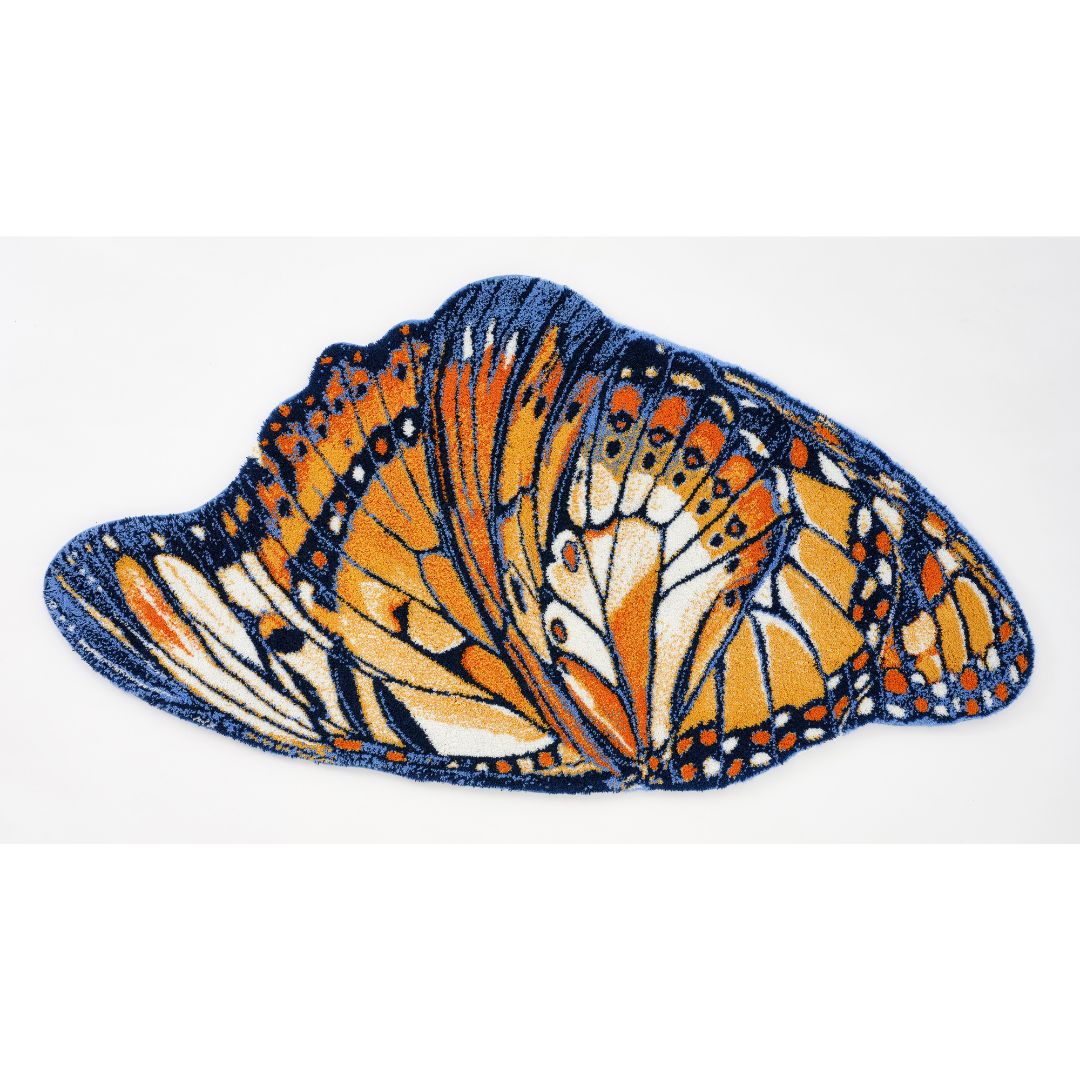 The Abyss Habidecor Mariposa Bath Rug is shaped like a monarch butterfly wing and features luxury Egyptian cotton patterns.