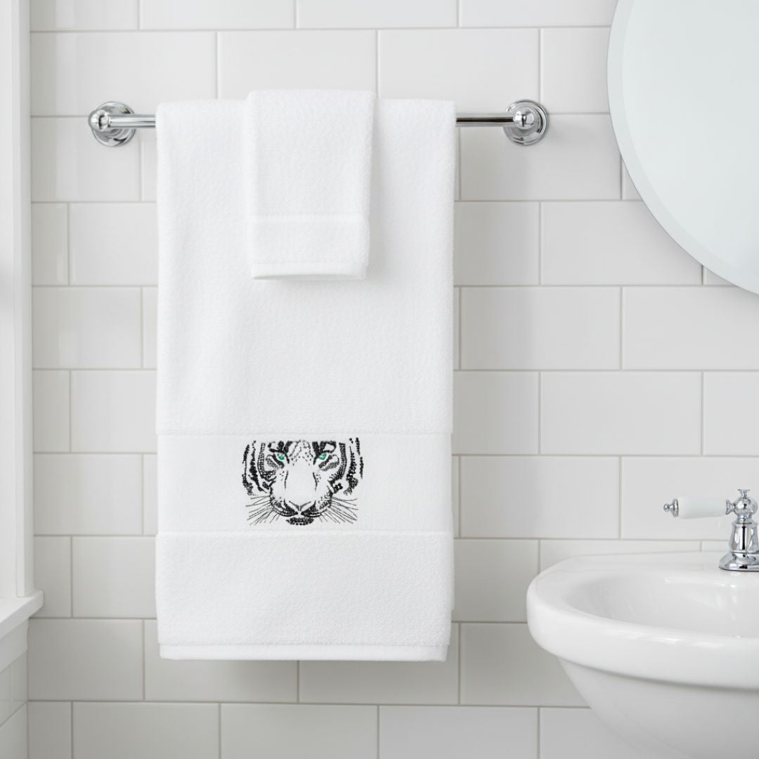 Abyss Tiger Embroidered Bath Towel hanging in a bathroom