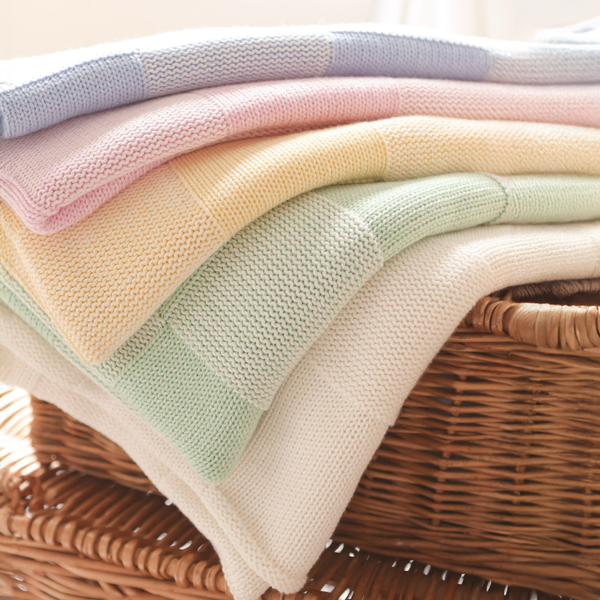 Stack of Alashan Charlie Knit Baby Blankets
