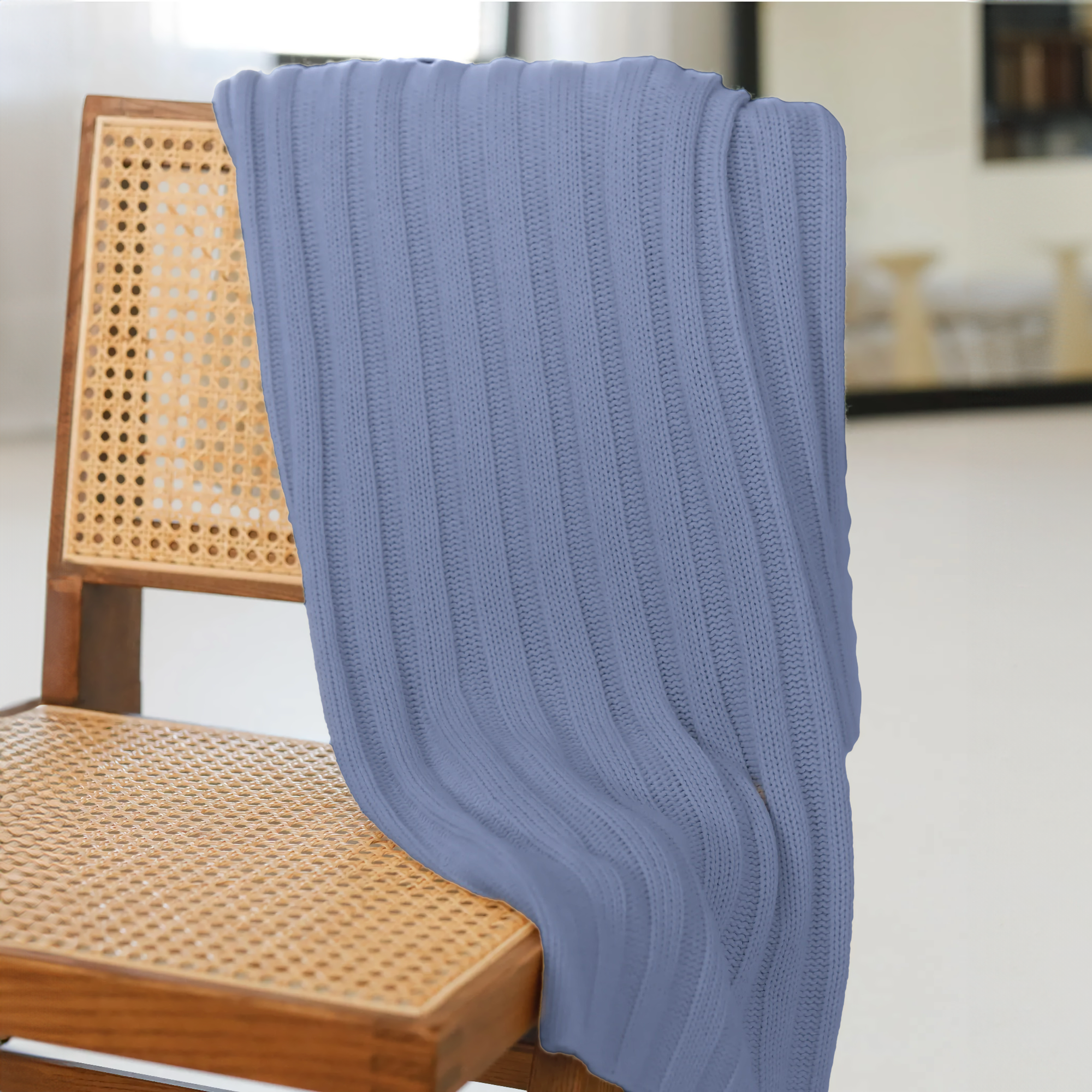 Alashan Chunky Rib Throw in Blue Lake on a chair