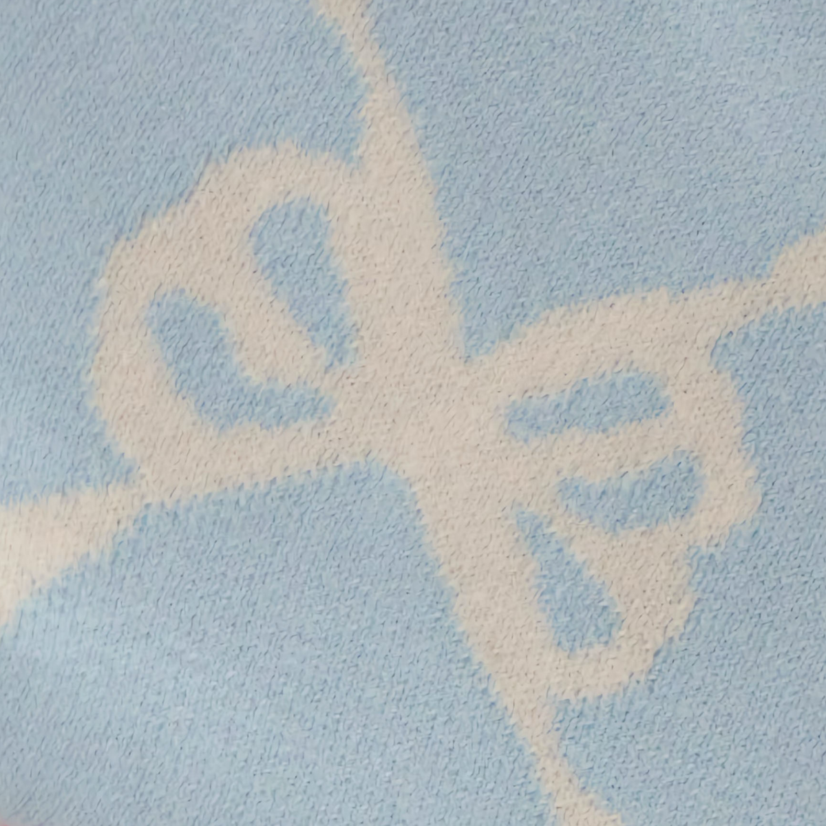 Fabric Closeup of Alashan Ellis Bow Knit Baby Blanket in Dream Blue