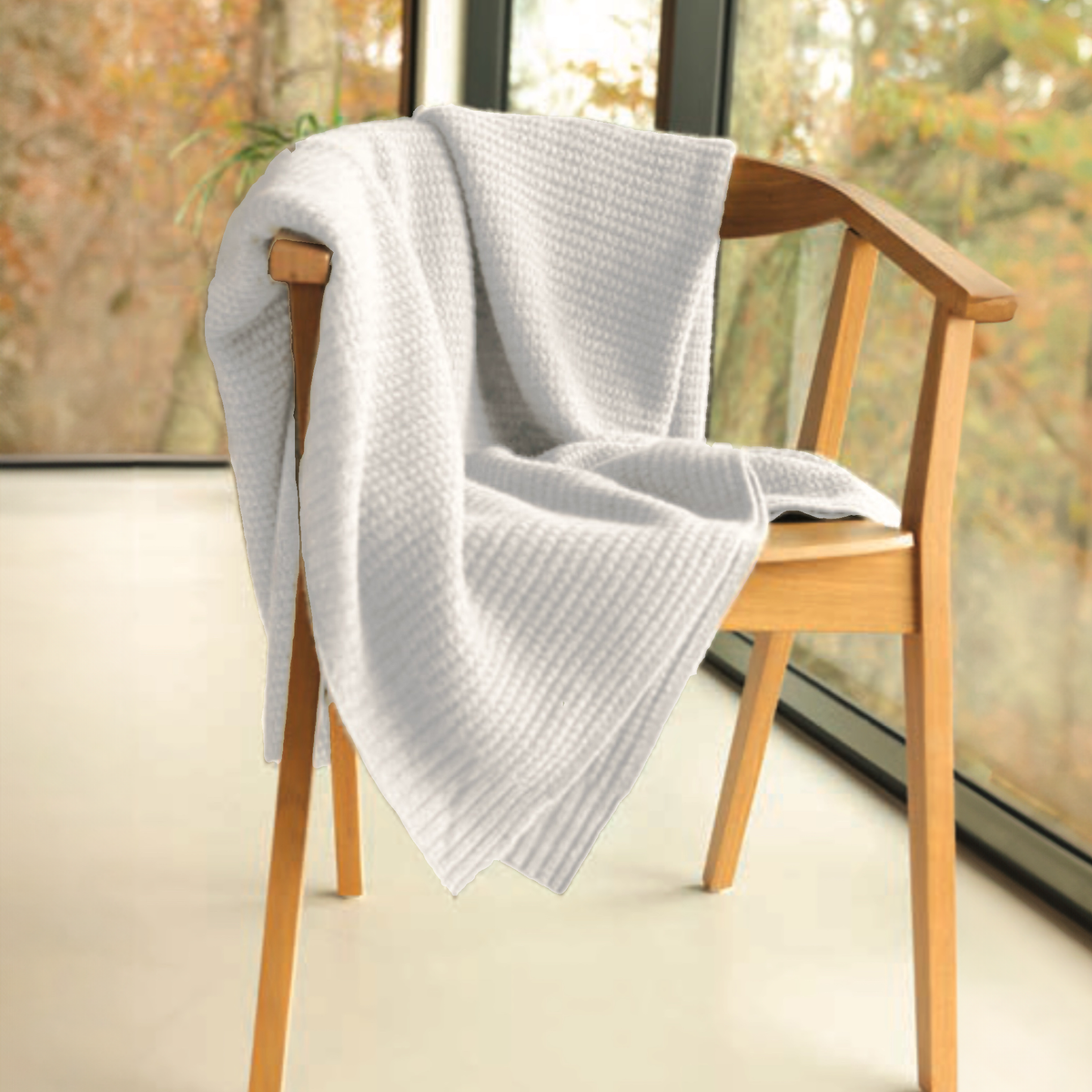 Alashan Harmony Throw in White on a chair