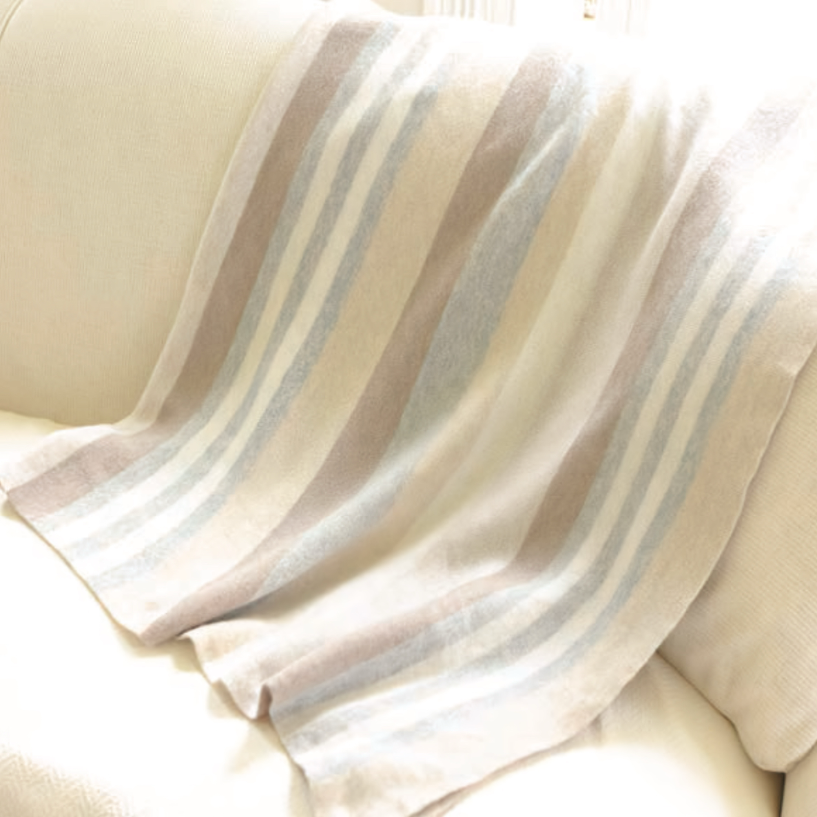 Alashan Santa Fe Double Faced Throw in Neutral Combo on a couch