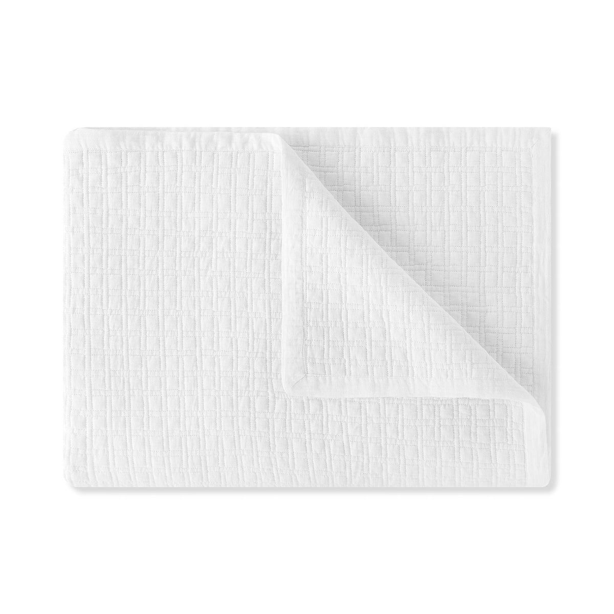 A folded White Amalia Adorno Quilted Coverlet