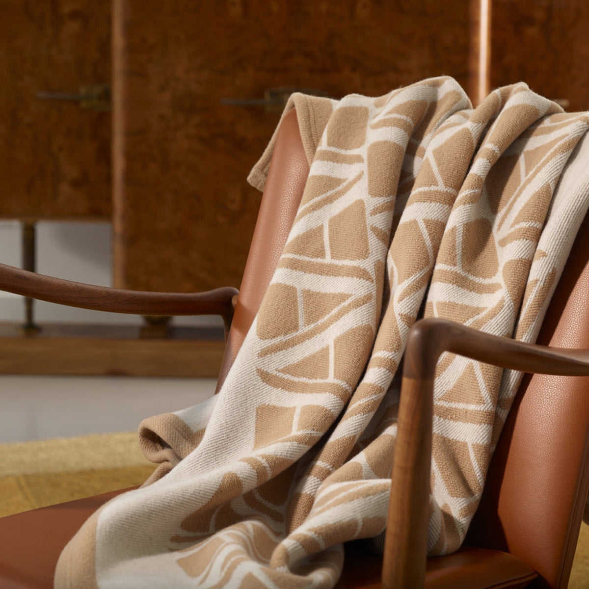 Sand Amalia Ama Throw on an armchair