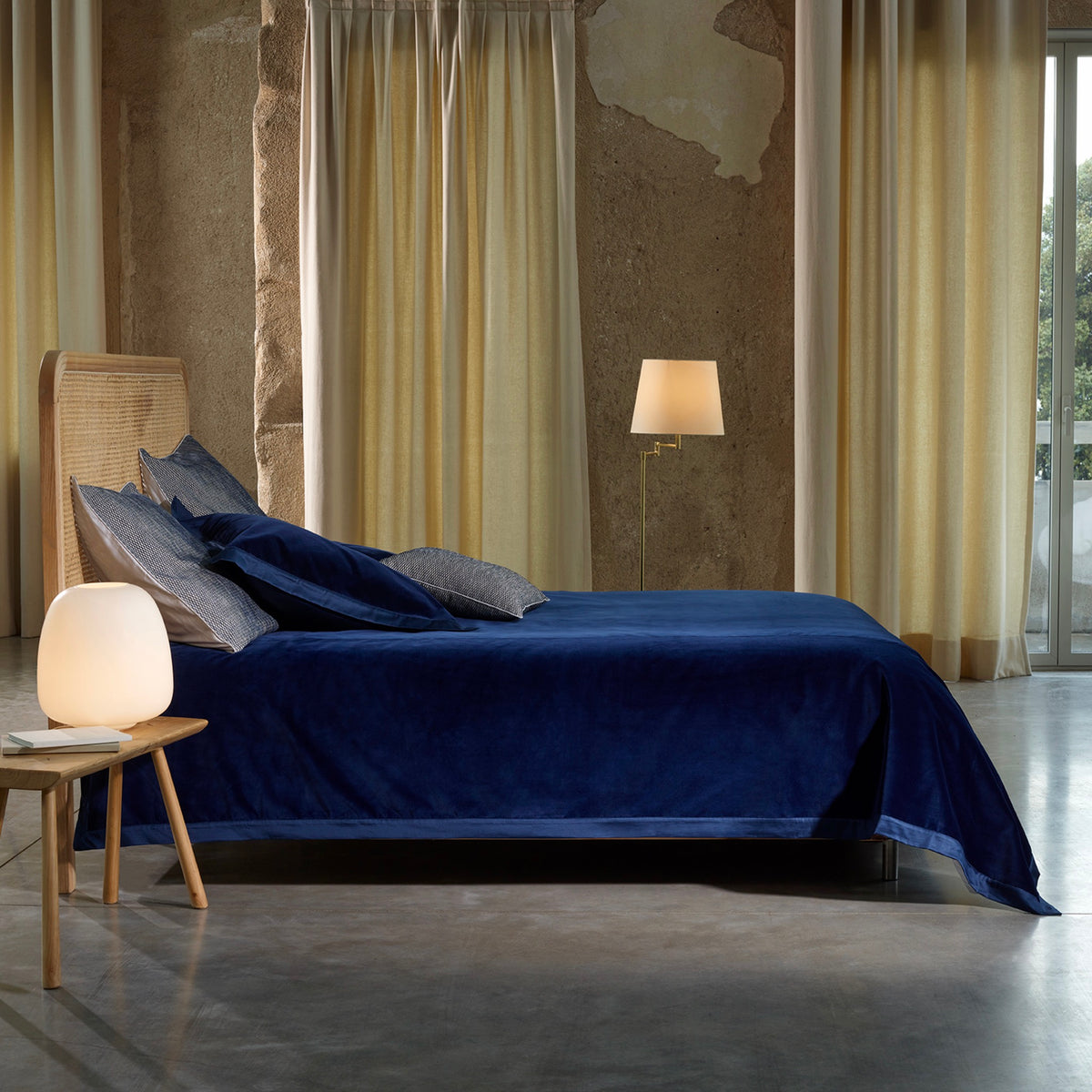 Bed with Navy Amalia Cirrus Velvet Bedspread and Pillows