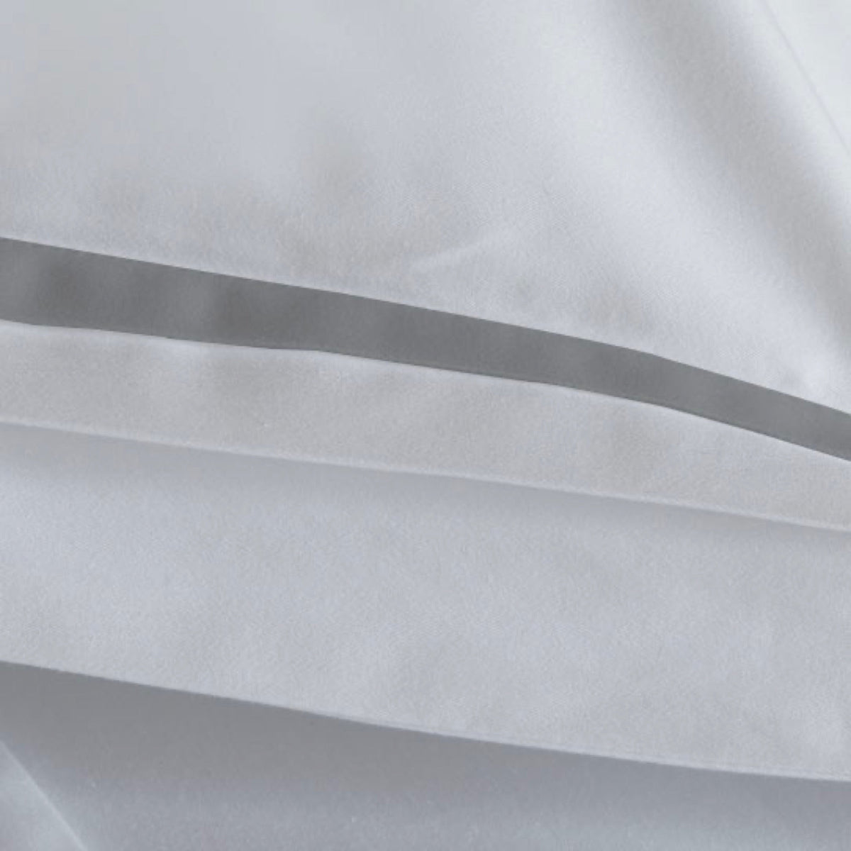 A close-up of Cool Grey Amalia Eden Sea Island Cotton Bedding