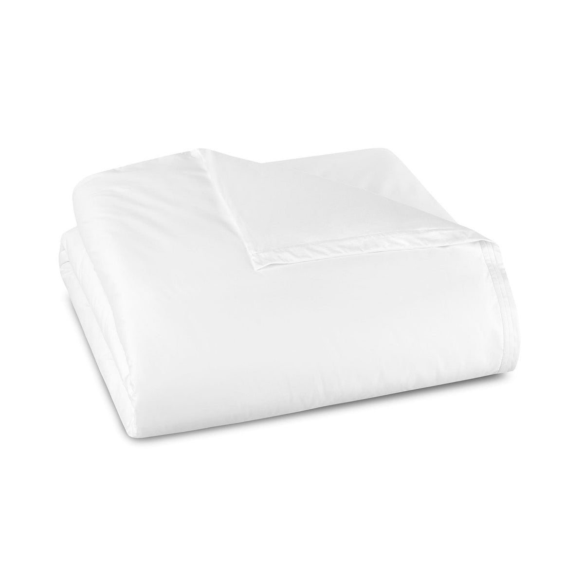 A neatly folded White duvet in luxury 750 thread count cotton from Amalia Eden Sea Island Cotton Bedding