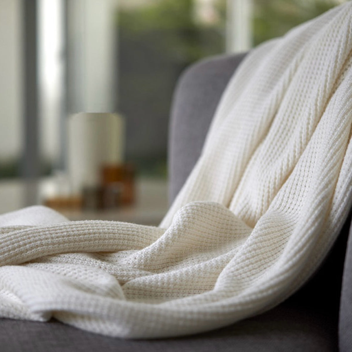 Closeup of Amalia Elemento Throws in Cream color