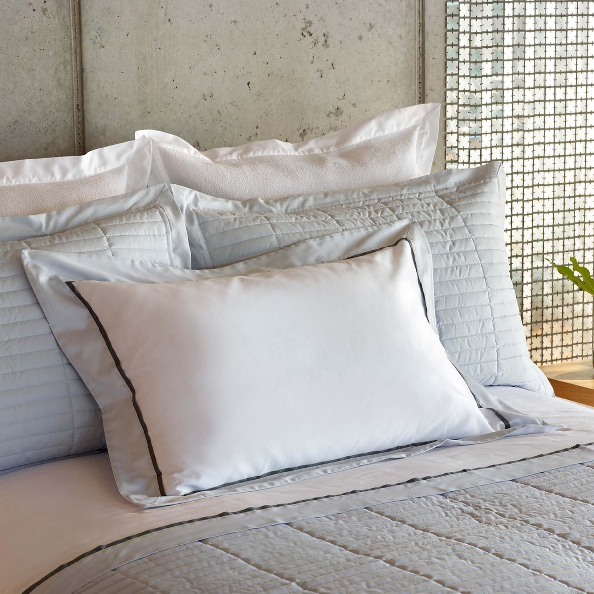 Bed with Pale Blue Amalia Fresco Quilted Bedding and coordinate pillows