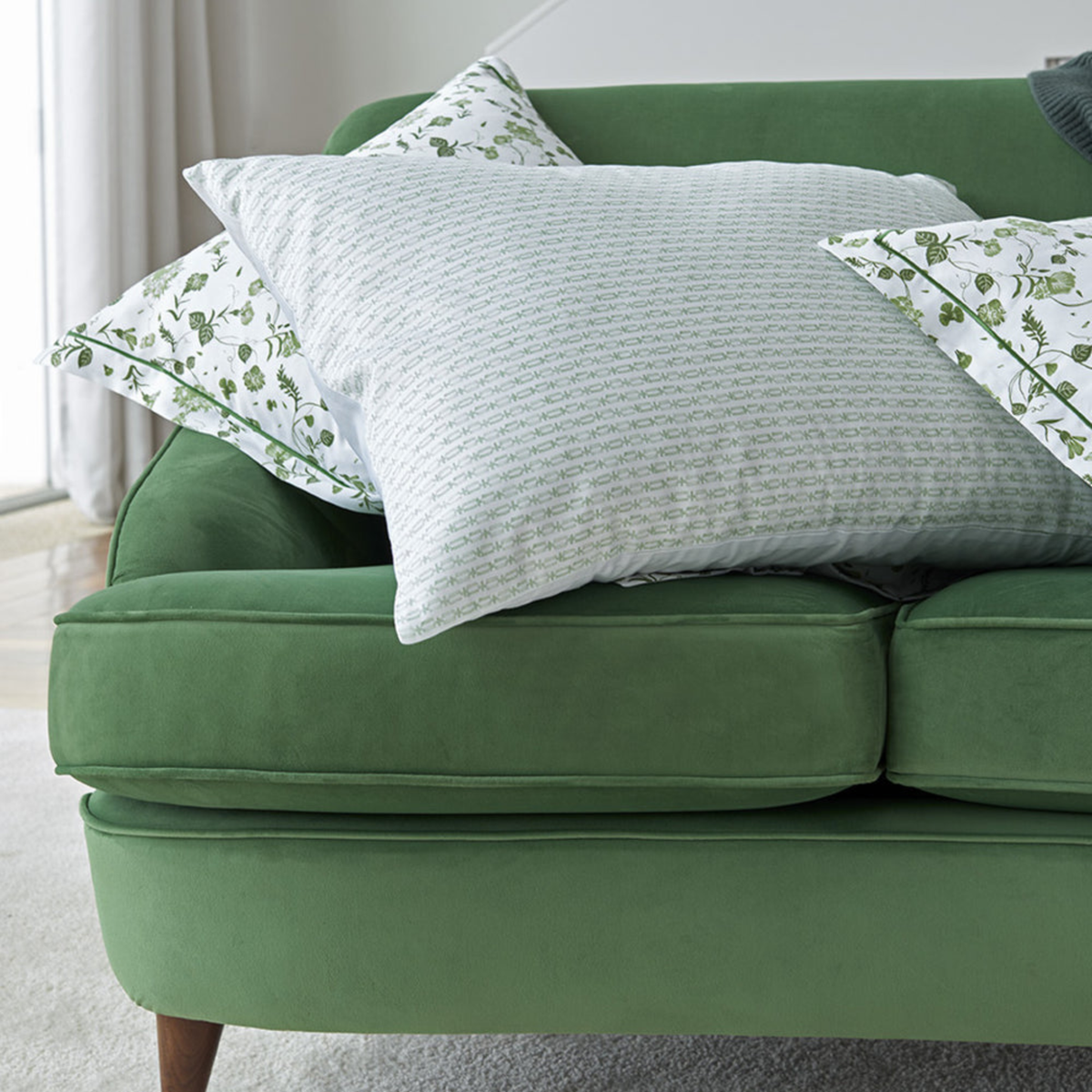 Pillowcase of Primavera Amalia Gaia Bedding on a green couch