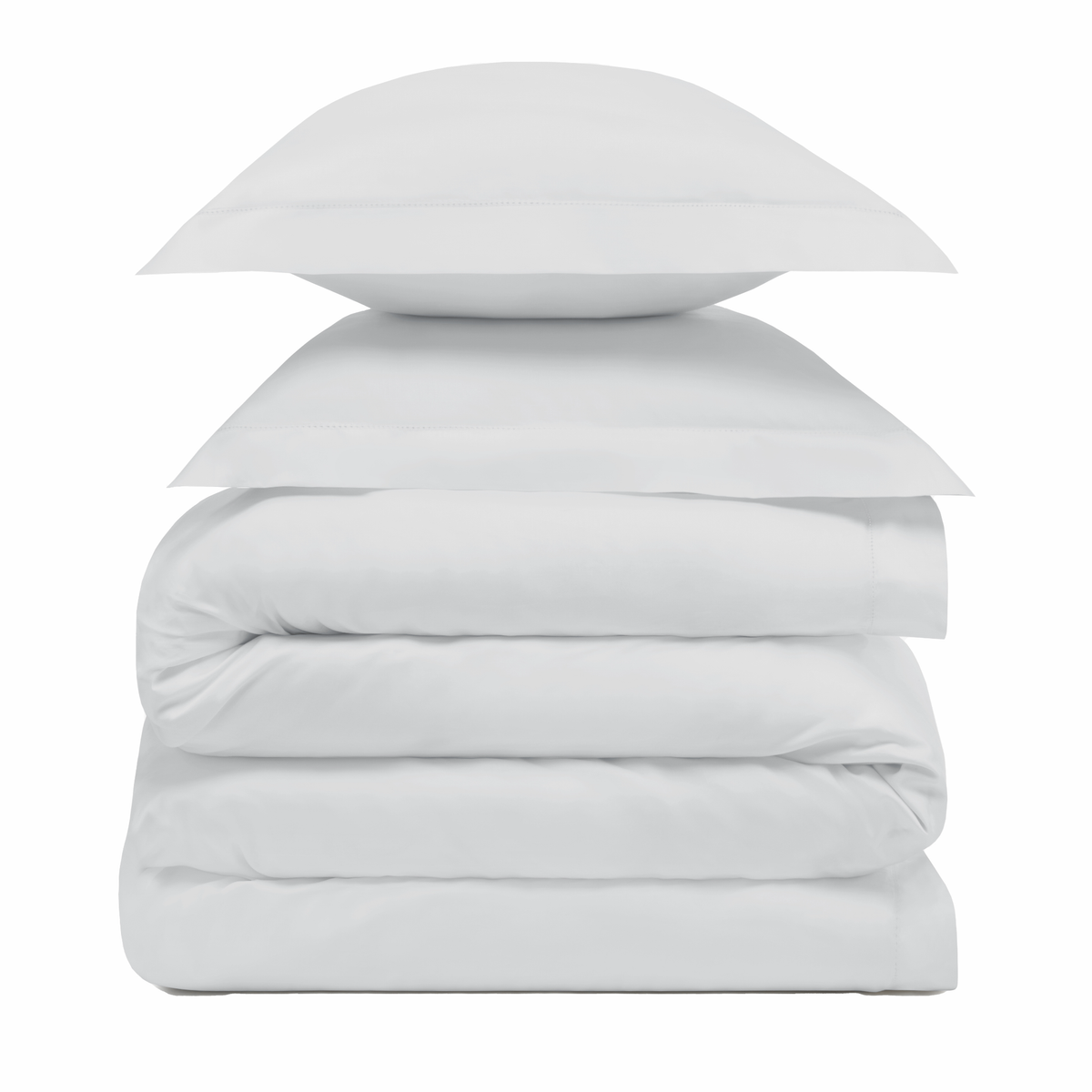 A stack of two Cool Grey pillows resting on folded Amalia Duvet Bedding Sheets