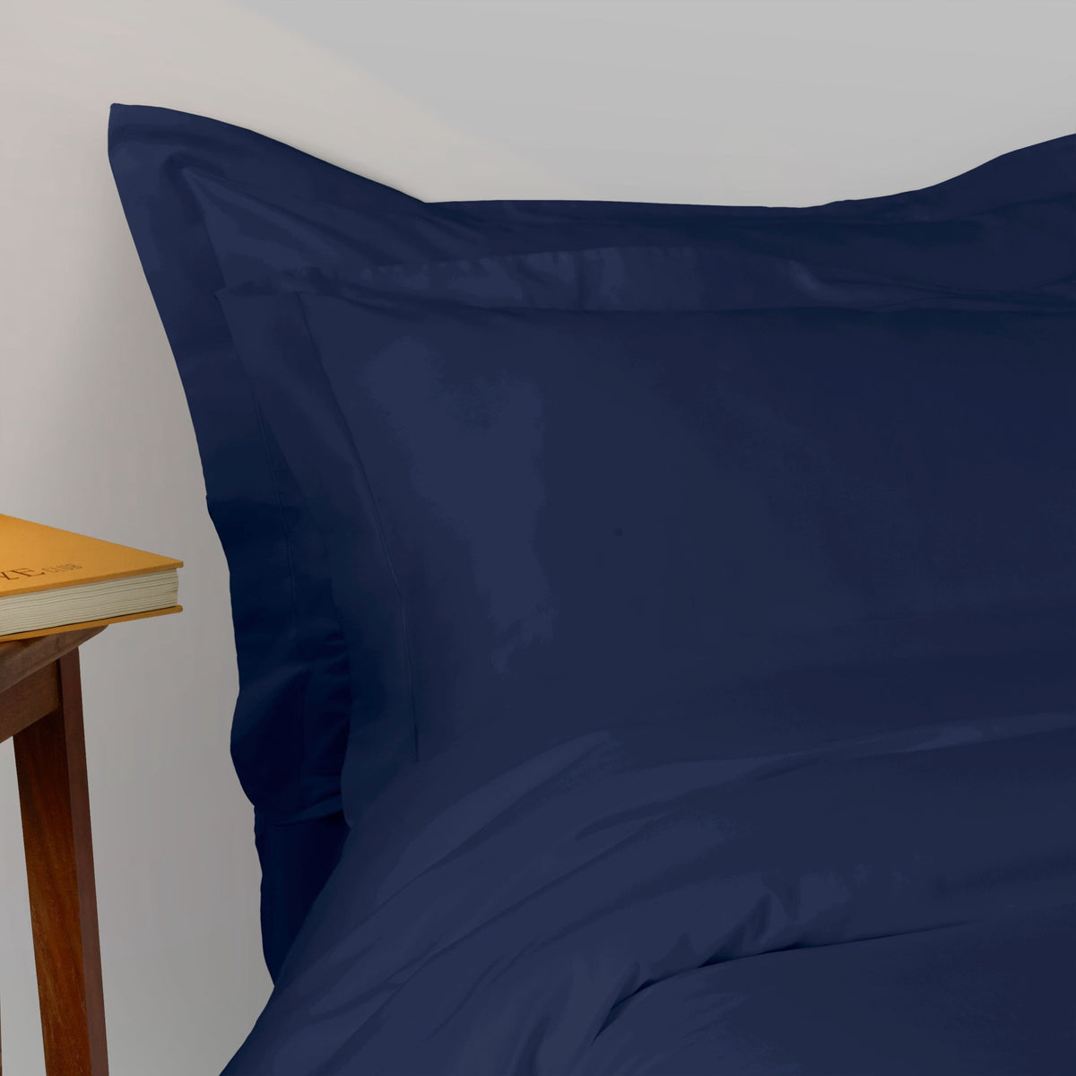 Closeup of A bed made with 430 thread count Midnight Amalia Suave Giza 94 Bedding