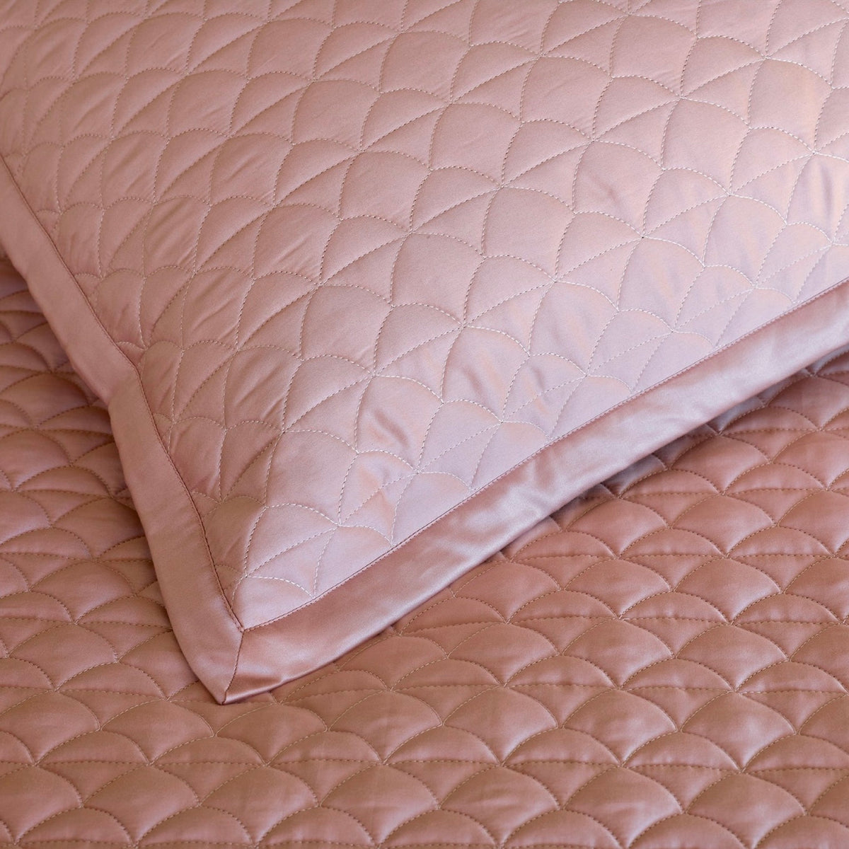 Closeup of Charm Pink Amalia Suave Quilted Bedding