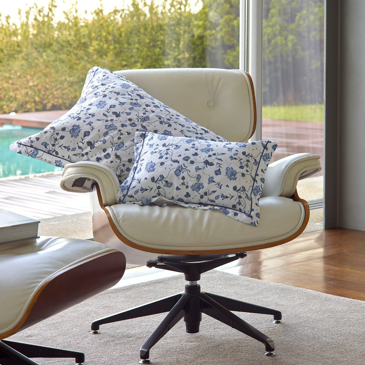 Off-white lounge chair with two Adorsia Amalia Vila-Flor Bedding pillows