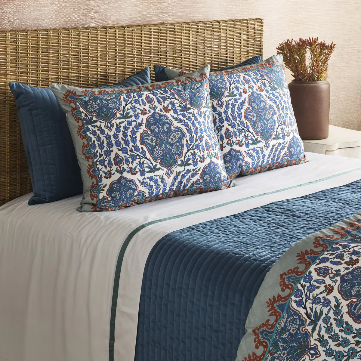 Side view of Teal colored Ann Gish Channel Velvet Coverlet Set with pattern coordinate bedding