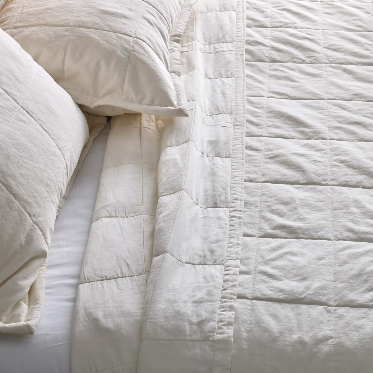 Top view of bed with Bone colored Ann Gish Cotton Canvas Coverlet Set