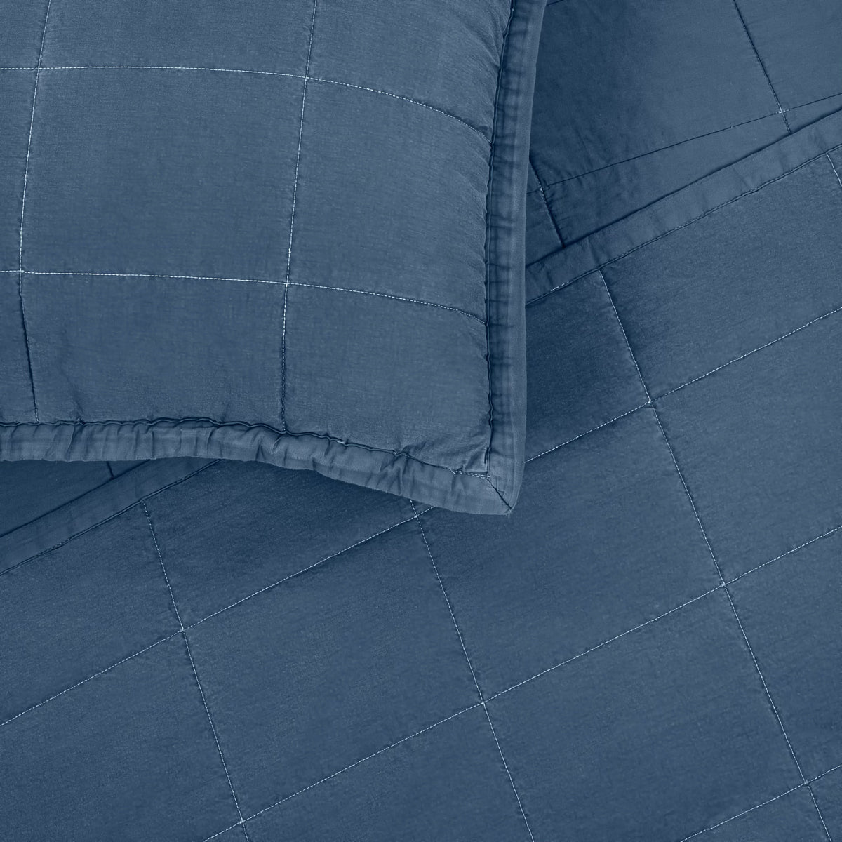 A close-up of Denim colored Ann Gish Cotton Canvas Coverlet Set