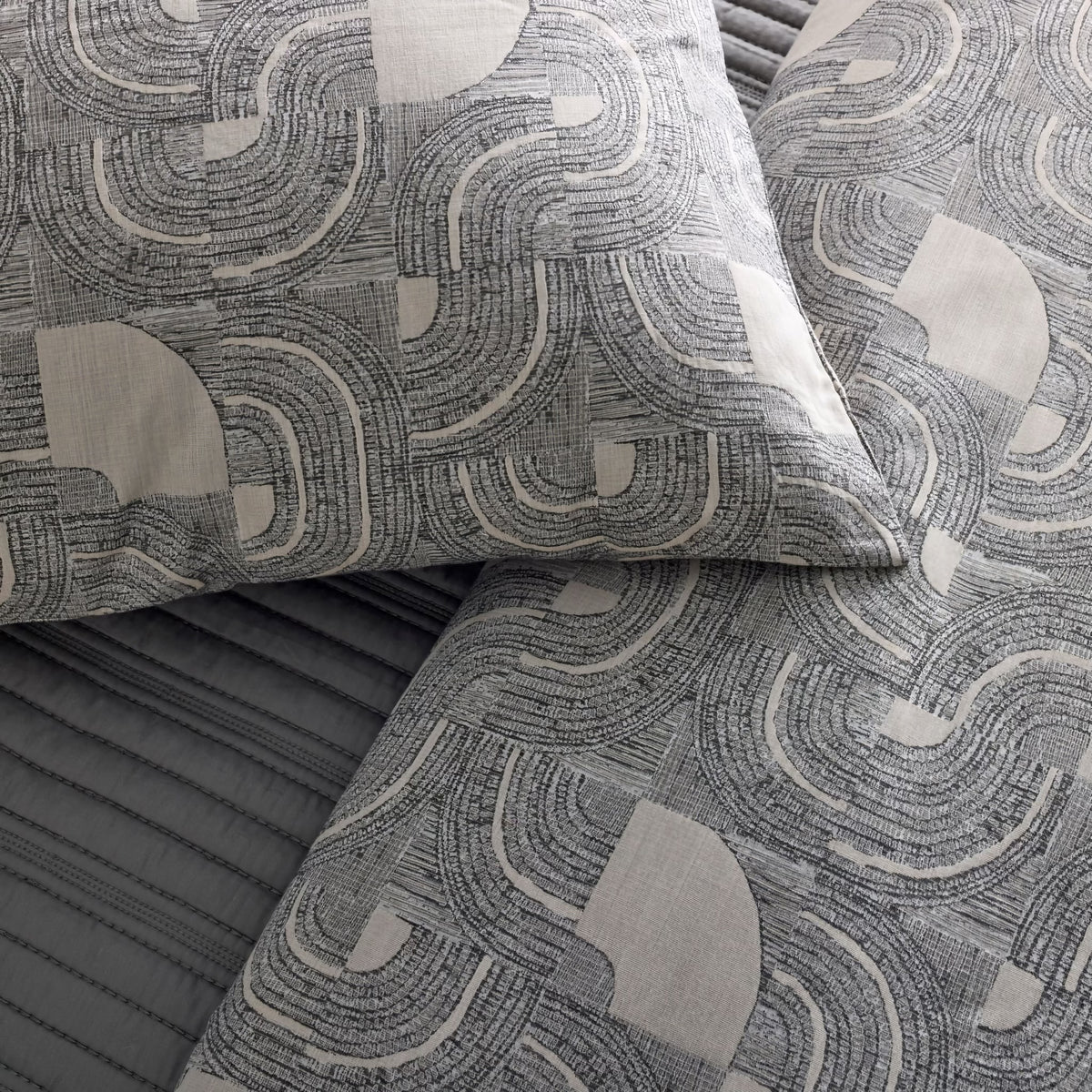 Detailed view of Charcoal and Pumice-colored Ann Gish Lugano Comforter Set