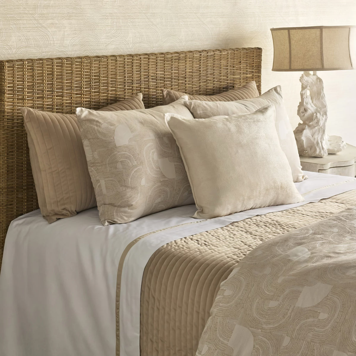 Side view of Sandstone-colored Ann Gish Lugano Comforter Set with coordinate beige bedding 