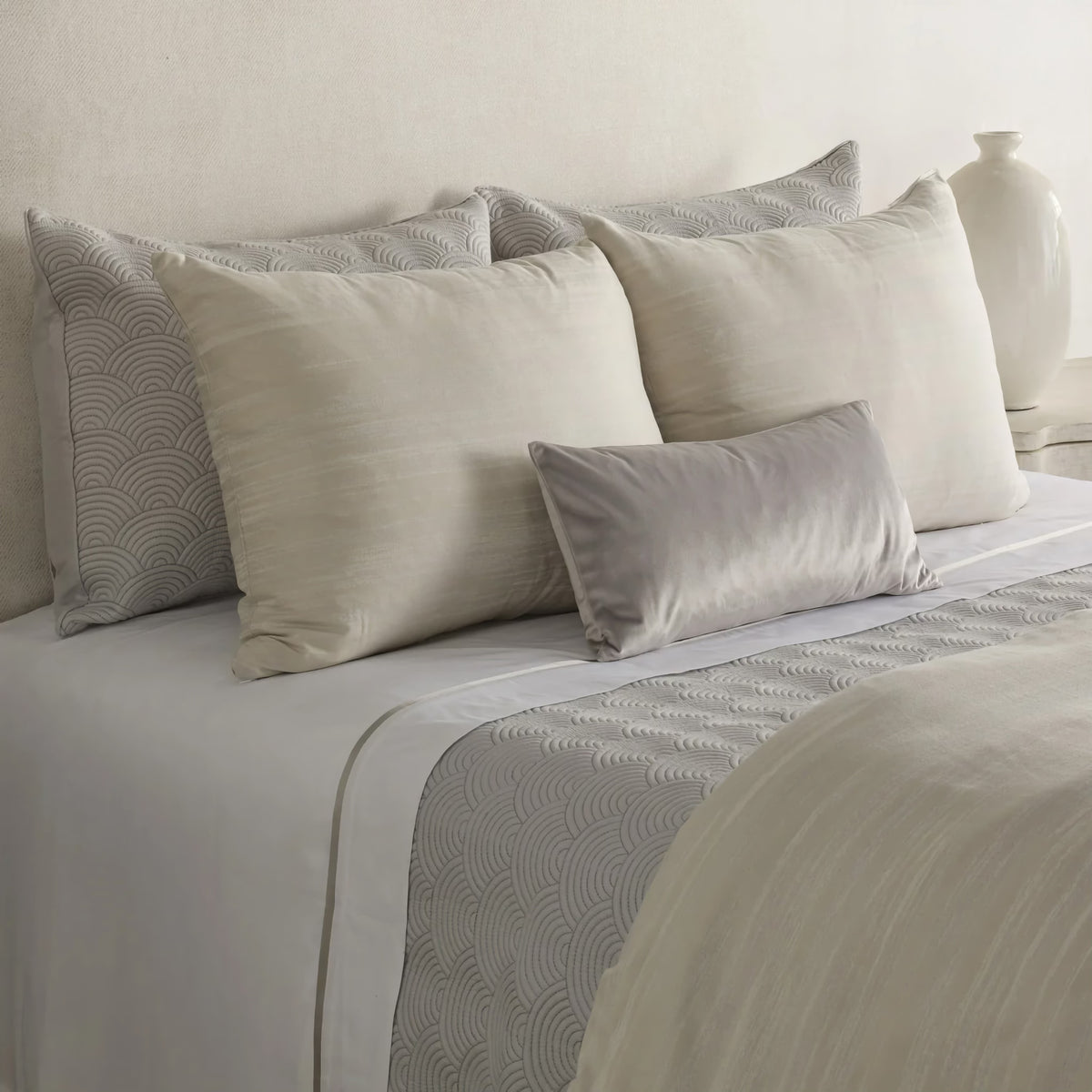 Side view of Pearl-colored Ann Gish Palais Comforter Set with coordinate bedding