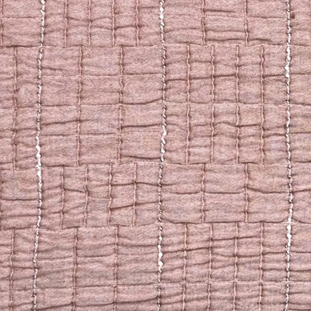 Close-up of a cotton Terra Cotta colored Ann Gish Pickstitch Coverlet Set