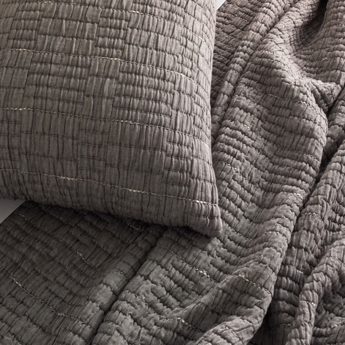 A close-up of a textured Charcoal colored Ann Gish Pickstitch Coverlet Set
