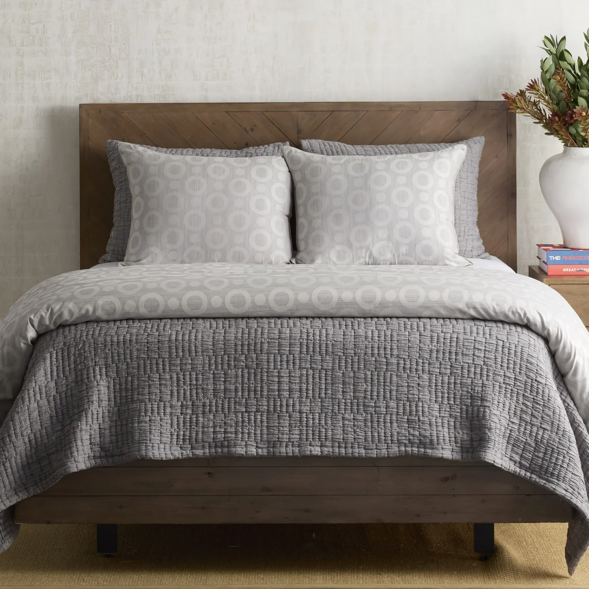 Charcoal colored Ann Gish Pickstitch Coverlet Set with circular pattern coordinate