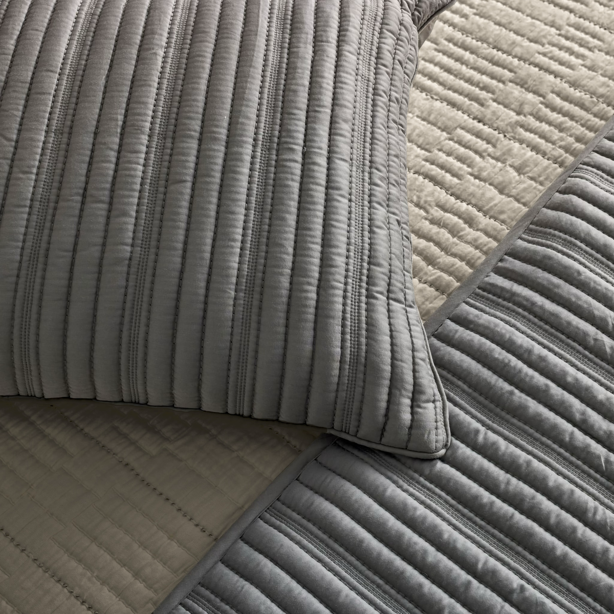 A close-up of Pumice and Slate colored Ann Gish Rib Coverlet Set