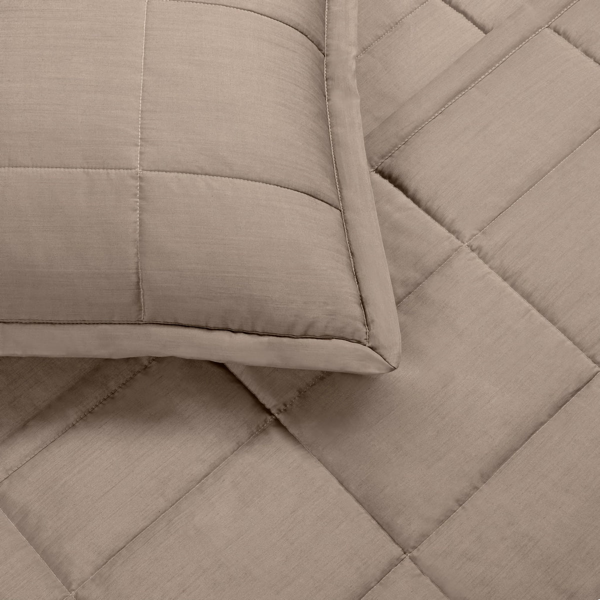 A close-up of a Cafe au Lait colored Ann Gish Slub Tencel Quilted Coverlet Set