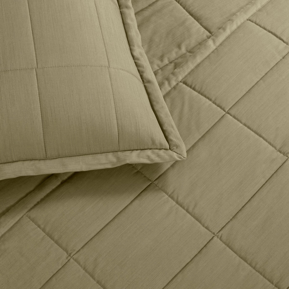 A close-up of a Olive colored Ann Gish Slub Tencel Quilted Coverlet Set