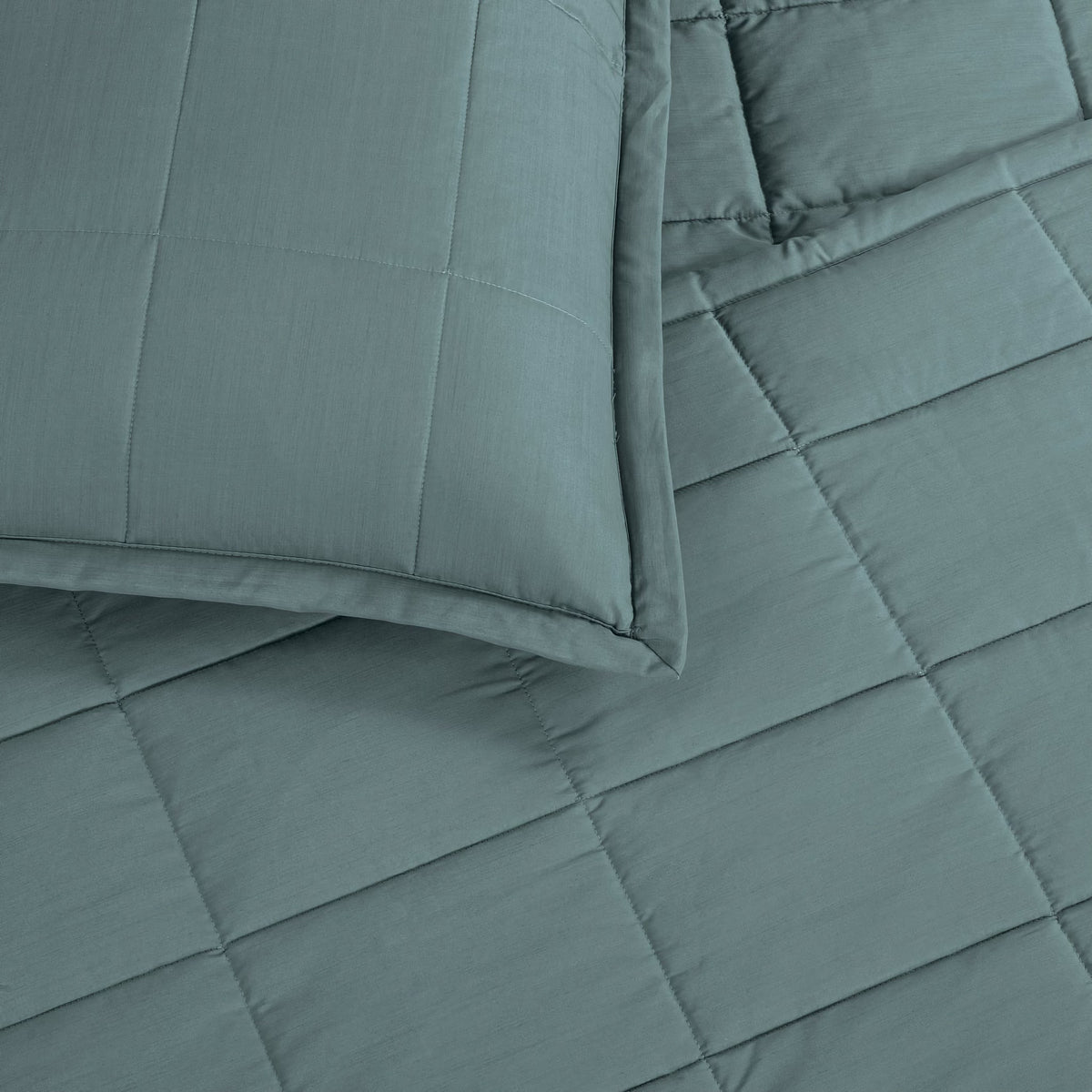 A close-up of a Sea colored Ann Gish Slub Tencel Quilted Coverlet Set