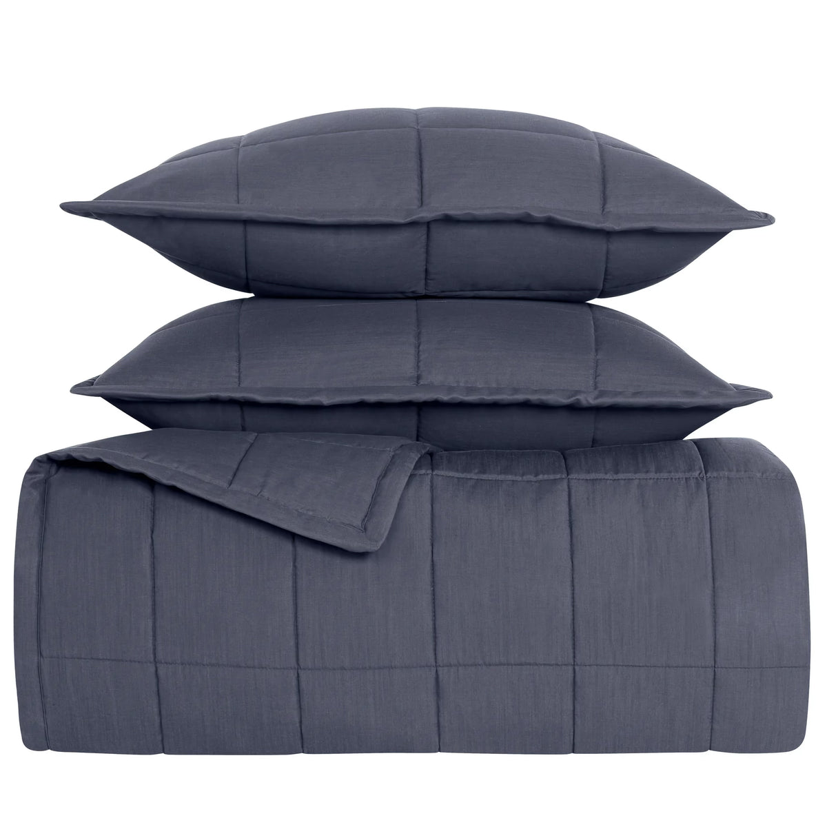 Stack of Marine colored Ann Gish Slub Tencel Quilted Coverlet Set