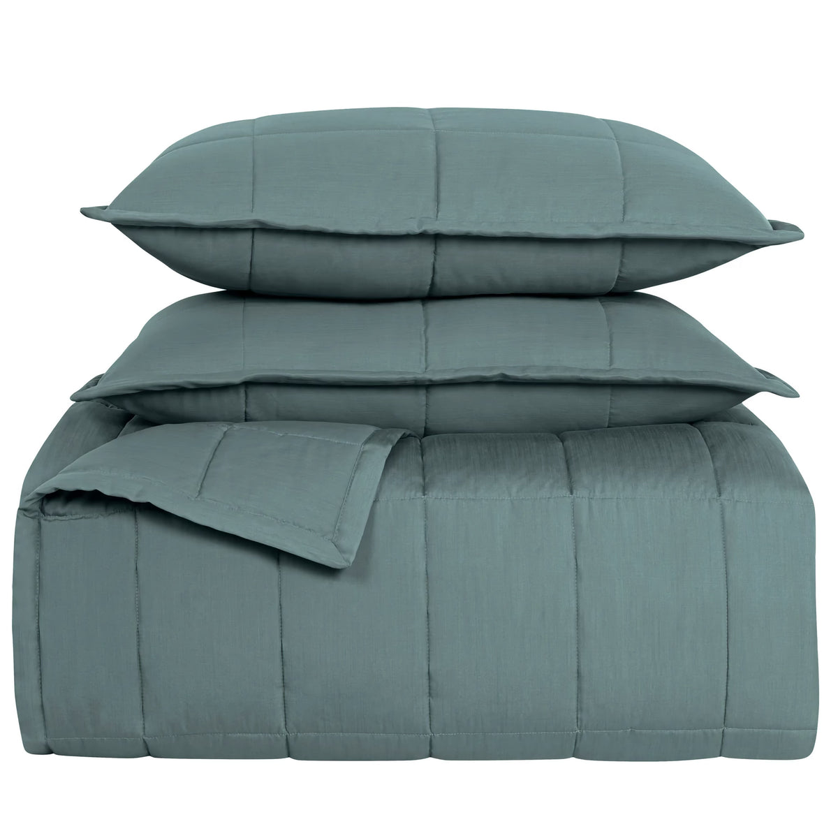 Stack of Sea colored Ann Gish Slub Tencel Quilted Coverlet Set